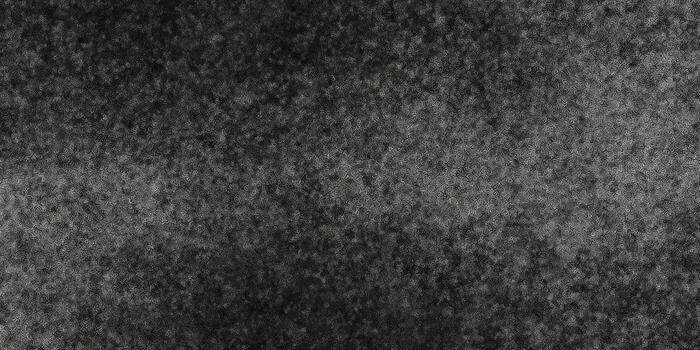 This dark background with a granular texture is perfect for graphic design. photo