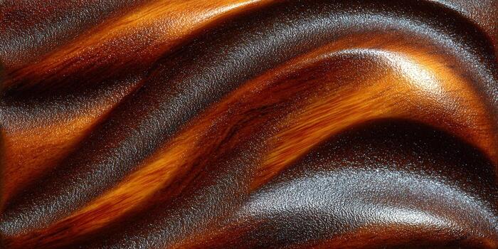 A close-up view of a beautifully textured wooden panel with curved lines and rich colors. photo
