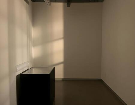 Illuminated Display Box Featuring Shadows That Form a Stylish Frame on the Wall photo