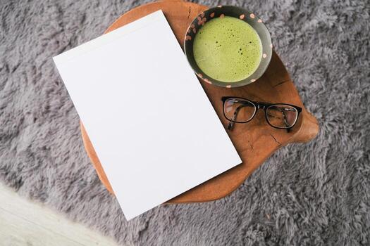blank magazine mockup coffee table with green matcha tea photo