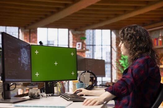 Startup admin using green screen PC, coding AI algorithm and machine learning models enhancing automation. IT specialist using chroma key computer in artificial intelligence Silicon Valley workplace photo