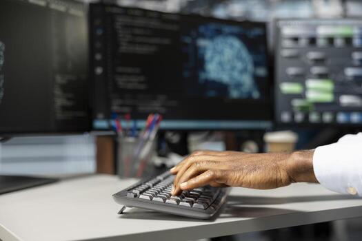 Close up of engineer setting up data center equipment needed to run artificial intelligence and machine learning processes. Server room worker typing on PC keyboard, using AI tools photo