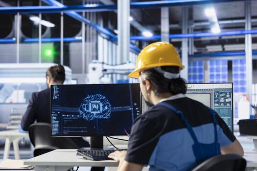 Engineer developing AI diagnostics tool in photovoltaic factory to predict component failures. Solar panels plant technician coding artificial intelligence algorithms to enhance predictive maintenance photo