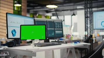 Empty high end workstation with computers and mockup on tablet, showcasing analytics tools for forecasting and business strategy. Support modern development and operational efficiency. video