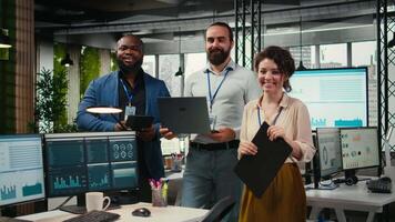 Portrait of multiethnic employees work with performance metrics and high tech, aligning business strategy and objectives to drive results and success within a multinational company. Camera A. video