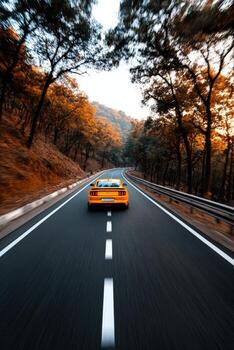 A yellow sports car driving down a road photo