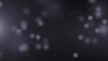 Dark abstract elegant background with floating blurred white particles and shimmering bokeh effect creates a soft, dreamy atmosphere. Perfect for cinematic, ambient or elegant designs. Seamless loop. video