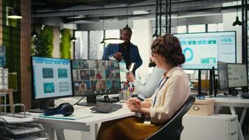 Employees sharing ideas on a web conference call at the workstation, discussing about project briefing with charts and reports. Business associates attending online meeting event. Camera A. video