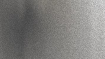 urban grå nyanser subtila ljus mönster spela tvärs över en texturerad grå yta skapande dynamisk visuella för bakgrunder. video