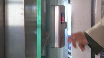 Activating elevator button in modern building lobby video