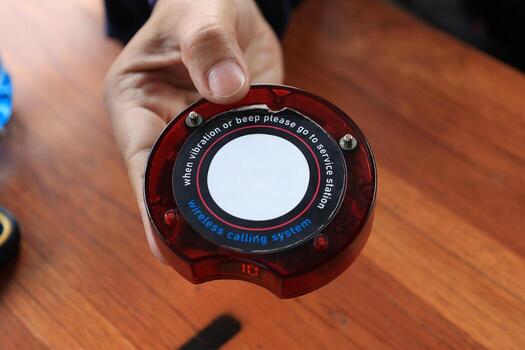 An Queue Paging Wireless Calling System with Red Light Alarm. photo