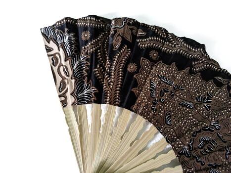 a fan with a black and white design photo