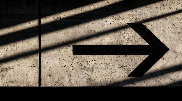 A black arrow pointing in a direction photo