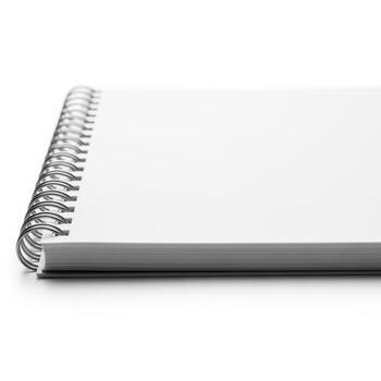 An open notebook with spiral binding on a white background photo