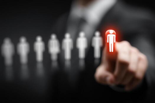 A person is pointing at a person with a red light photo