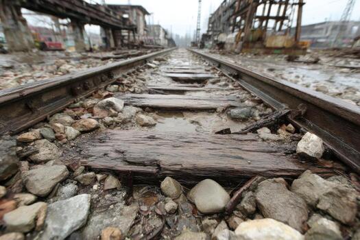 A train track is covered in mud and debris photo