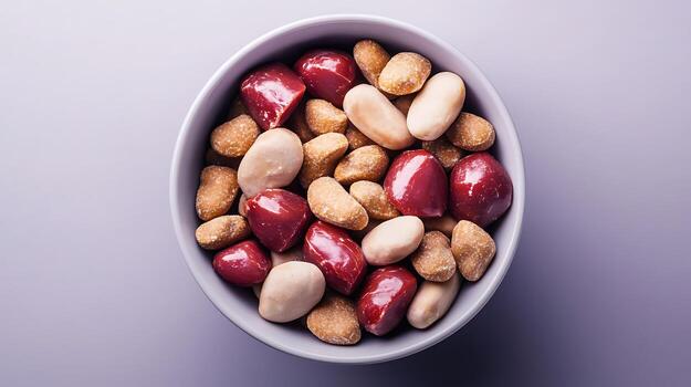 A colorful bowl filled with various nuts and beans on a soft gradient background photo