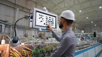 Operator working at programmable CNC machine in factory industries video