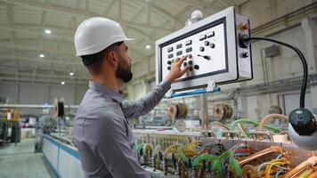 Industrial engineer working at programmable CNC machine in window factory video