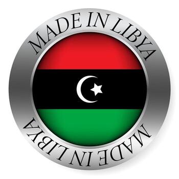 Made in Libya button icon. Circular emblem with metallic border, glossy central flag, and bilingual label indicating product origin and international manufacturing identity. vector