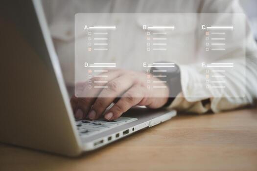 Man choose correct answer for assessment, online exam, online learning, computer based test using Internet technology photo