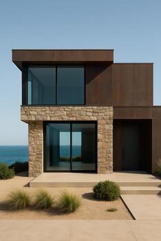 Modern beach house with stone walls and large windows photo