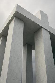 A large white building with columns and a cross on top photo