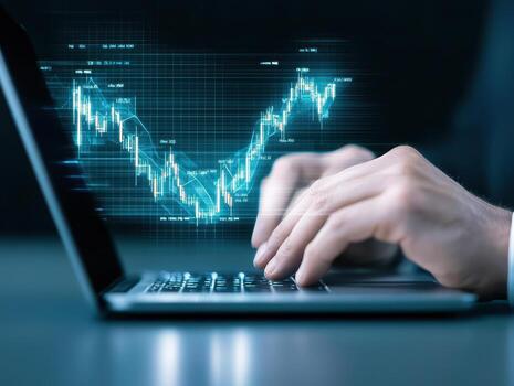 Stock market graph laptop computer business analysis financial data digital technology investment strategy hand typing photo