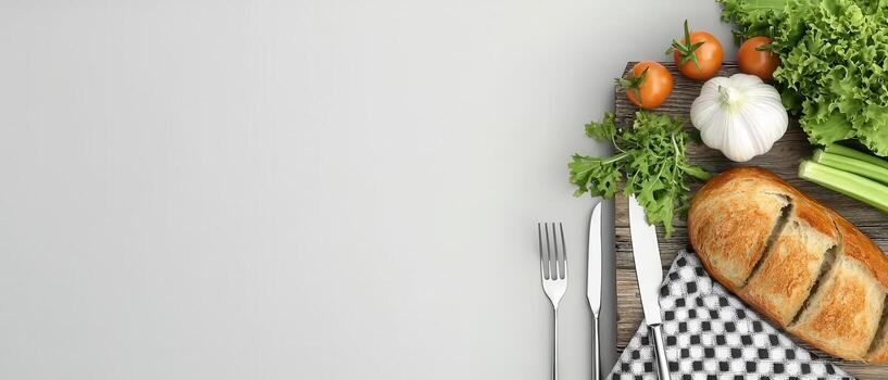Fresh vegetables and bread on rustic table setting photo