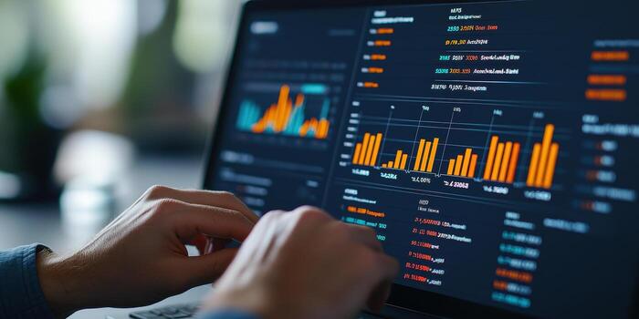 Hands adjusting data on financial dashboard with graphs photo
