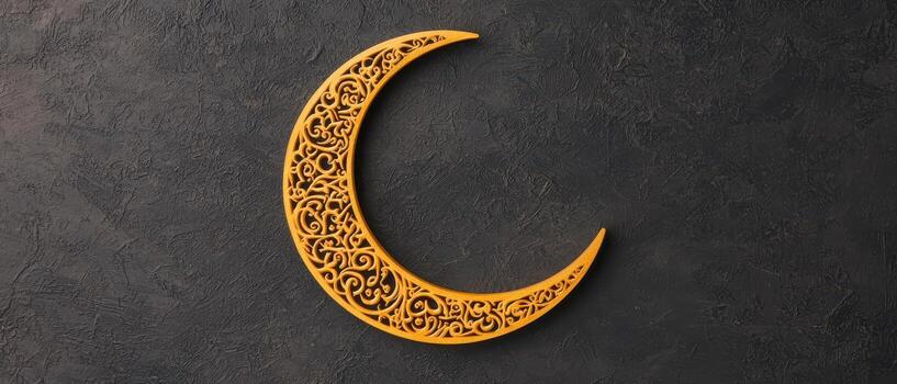 Ornamental crescent moon with intricate design on dark background photo