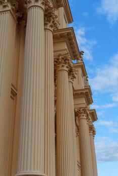 A large building with columns and a clock in potsdam photo