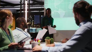 Business associates examining key performance indicators within the enterprise activity. Conducting evaluations and discuss updates to foster professional development, team efficiency. Camera A. video