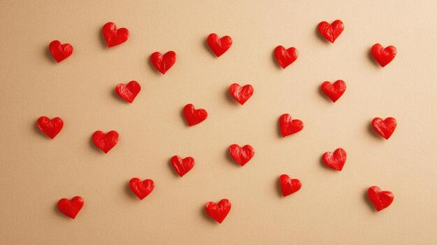 red hearts scattered on beige background photo