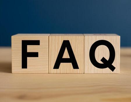 FAQ Block on Wooden Surface photo
