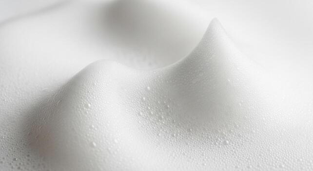 Abstract macro view of white foam with delicate bubbles, creating a soft, clean, and luxurious texture. photo