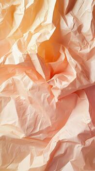 Abstract peach paper texture creates a dynamic crumpled pattern with bright light and shadow play photo