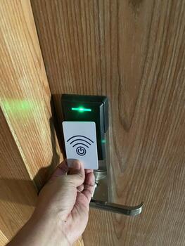 Contemporary Hospitality - Guest Checking In with Smart Key Technology. photo