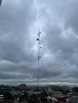 Wireless Technology - Network Antenna Tower Under Cloudy and Moody Weather. photo
