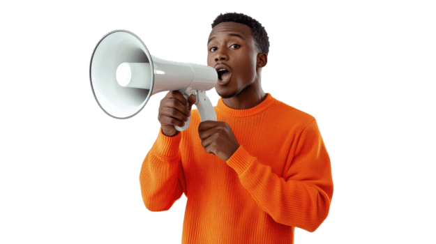 A young man passionately uses a megaphone in an orange sweater in a bright room png