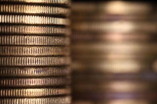 Stack of coins in close-up, texture of old coin, blurred background photo
