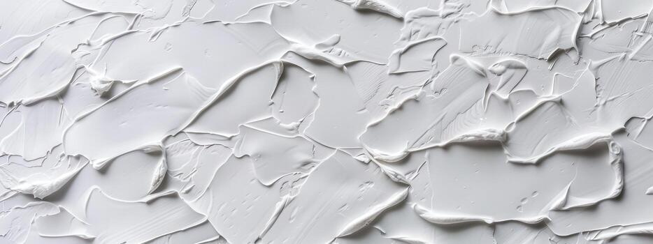 The wall is covered cracks and holes, giving it a rough and unfinished appearance. The texture of the wall is uneven and jagged, with no clear pattern or design. Scene is one of neglect and decay photo