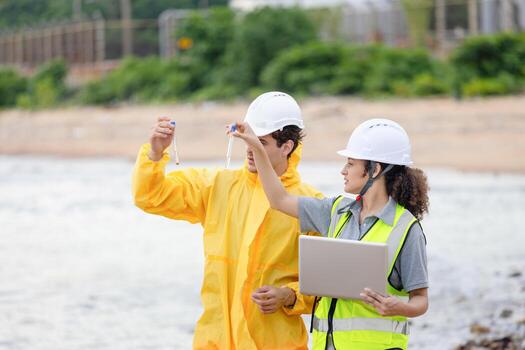 Scientists at Work in the Field, Environmental Scientists Collecting Water Samples for Analysis, Researchers Testing Water Quality at a Lake or Coastal Area photo