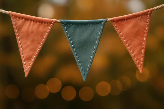 Coral and Teal Bunting for Festive Decor and Celebrations on String Against Blurred Background photo