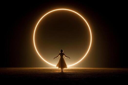 A woman standing in front of a large circle of light photo