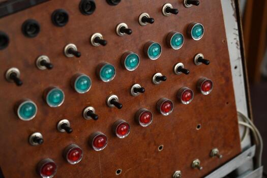 Retro control console with buttons and voltmeter. Panel used in analog signal processing and monitoring. photo