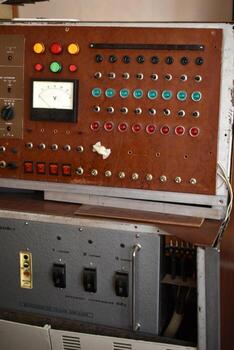 Industrial display board with analog meters and switching levers. A fragment of historic control technology. photo