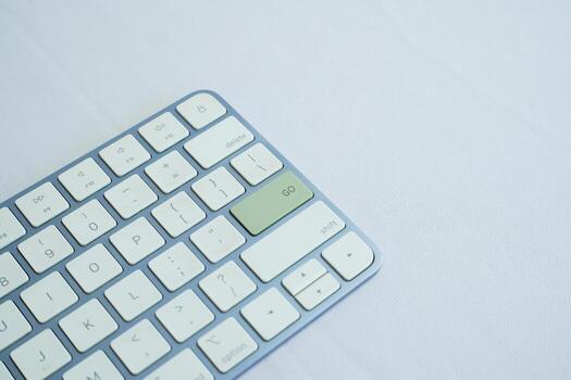 GO writing on a computer keyboard with a white background. business concept photo