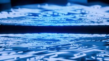 resumen de cerca de un futurista azul circuito tablero superficie, representando digital datos fluir, avanzado electrónica, y alta tecnología informática. ideal para tecnología antecedentes. video