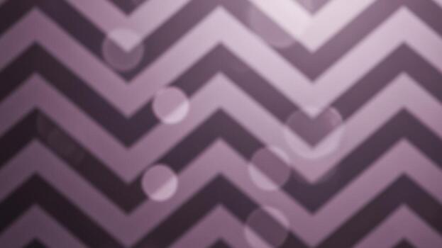 A purple and white chevron pattern on a dark background photo